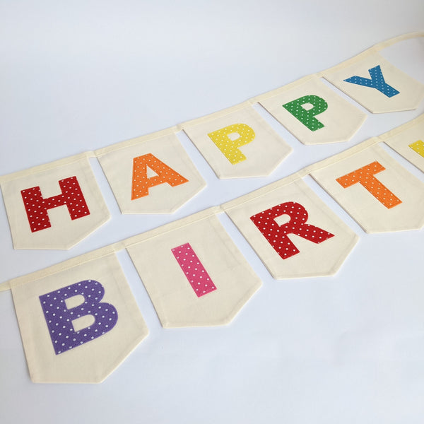 Close up of Bright Rainbow Coloured 'Happy Birthday' Fabric Bunting