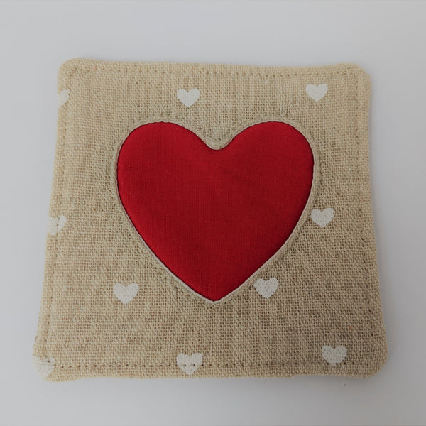 Close up of fabric heart coaster